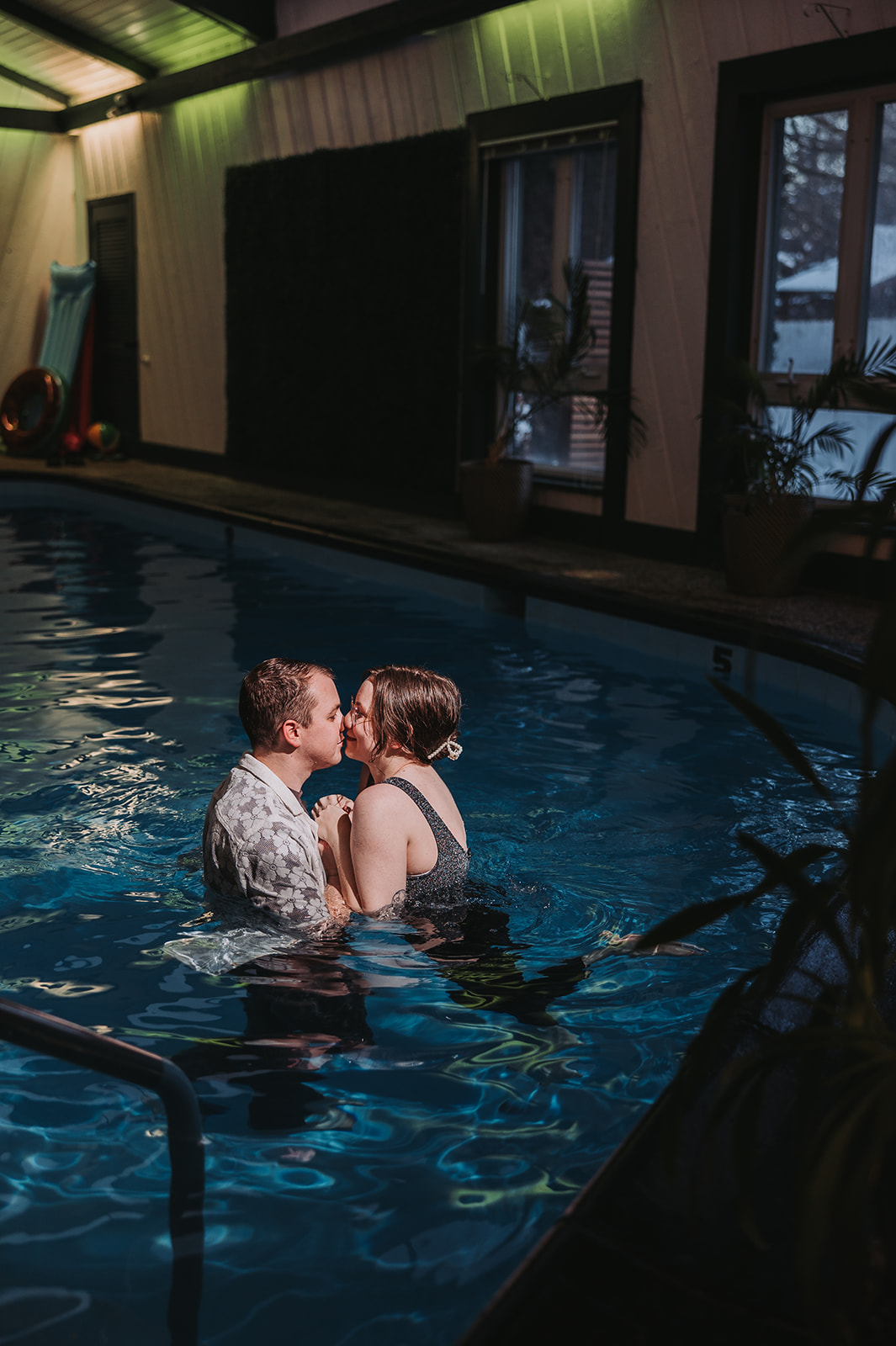 romantic nighttime couples photos at a pool in minneapolis