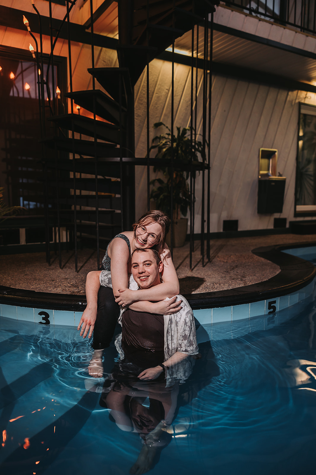 sweet nighttime couples photos at a pool in minneapolis