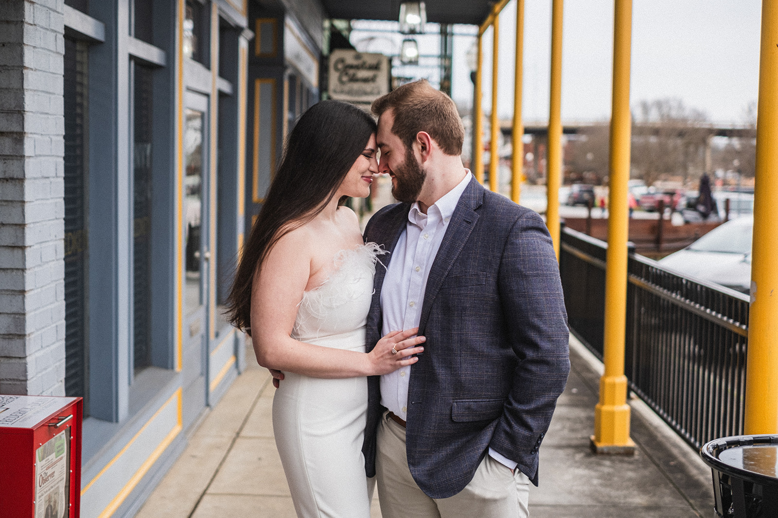 A couple celebrates their engagement to be married in historic downtown opelika alabama