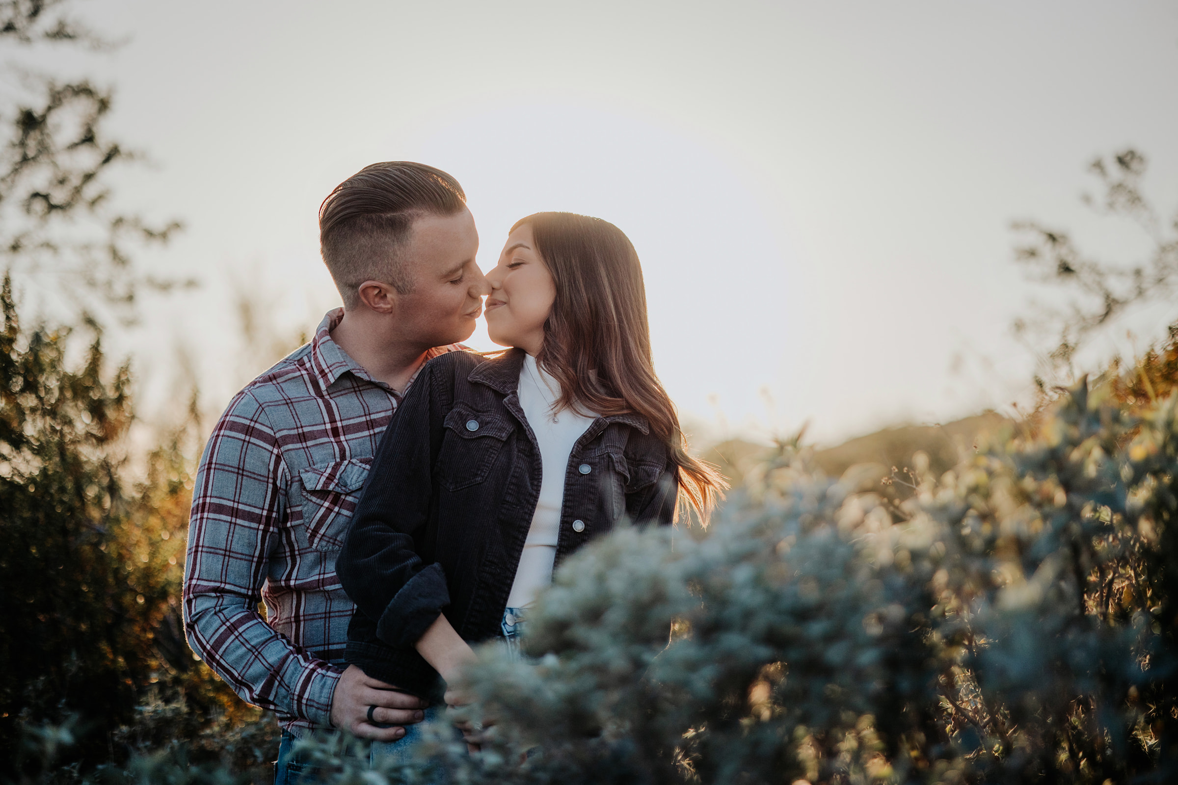 Wedding Engagement Session at sunset while Kissing