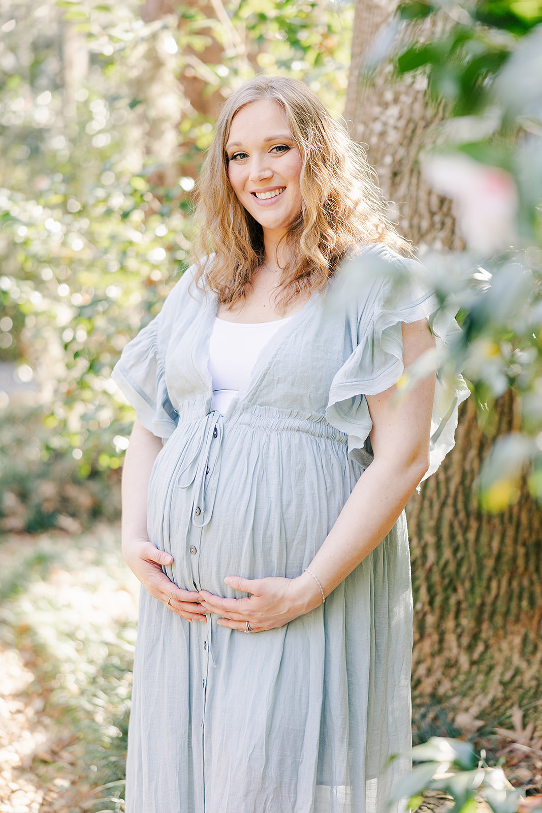 maternity photo of mom in powdery blue flowy dress