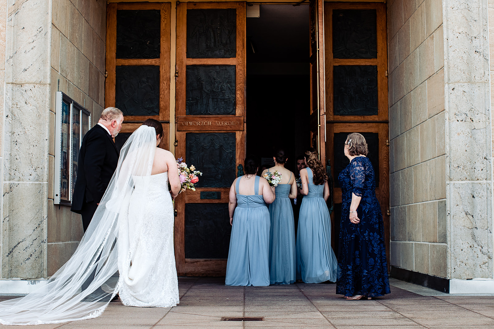 bride and people entering the national shrine of our lady of czestochowa church wedding ceremony