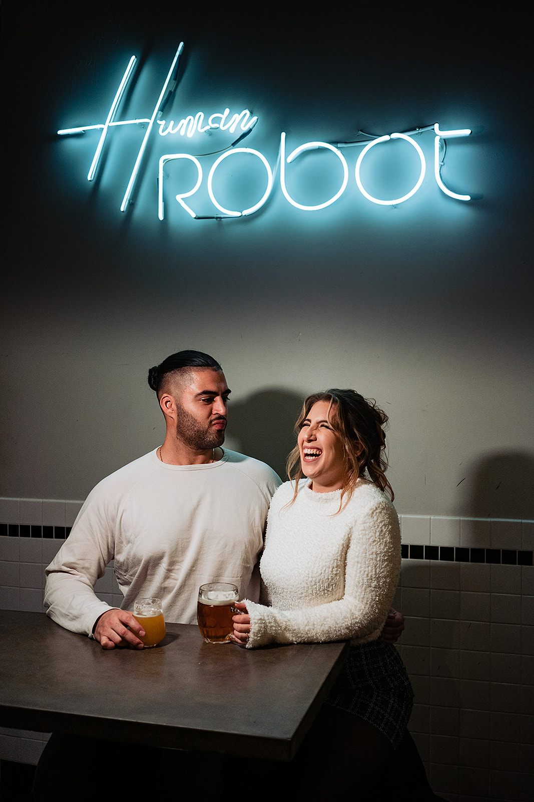 people with beers at human robot