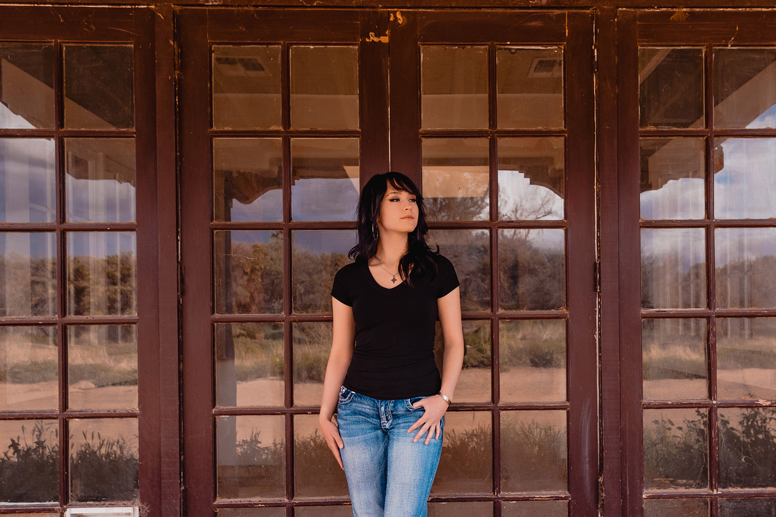 Senior Session In front of an Old horse stable Entrance.