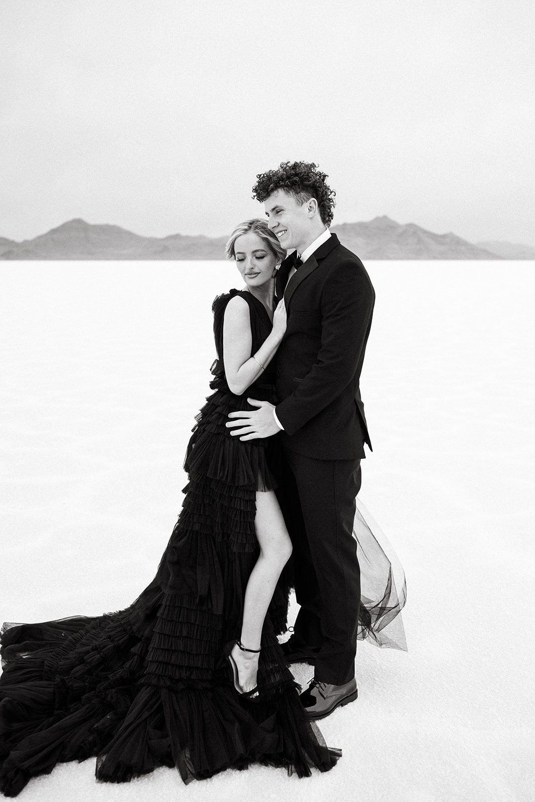 Black tulle dress swirls around bride at Utah Salt Flats’ photography shoot