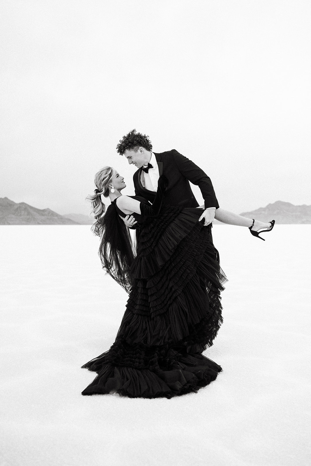Couple in black formal wear at Utah Bonneville Salt Flats engagement session