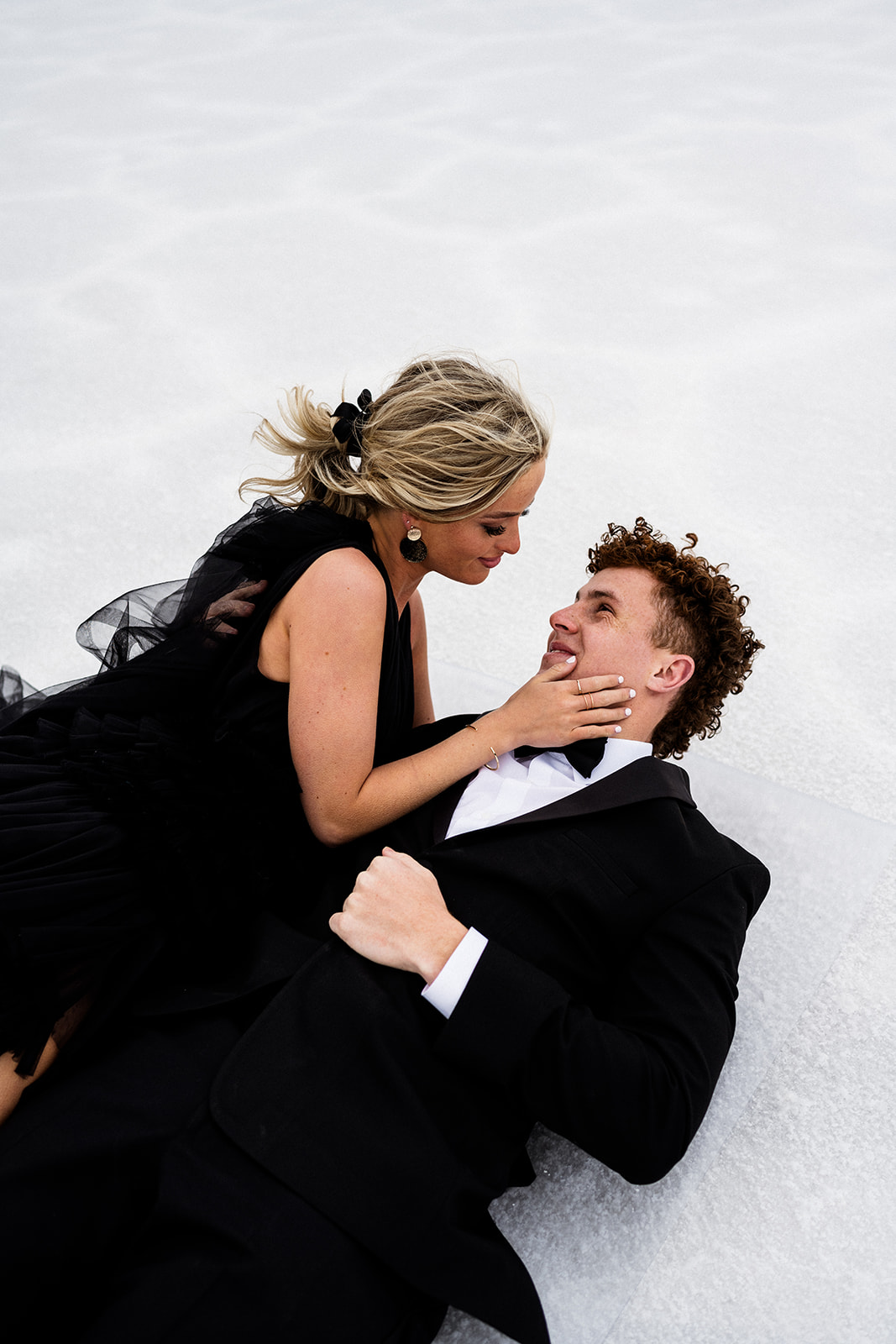 Couple gazes lovingly in a Utah Salt Flats wedding photo by local photographer.