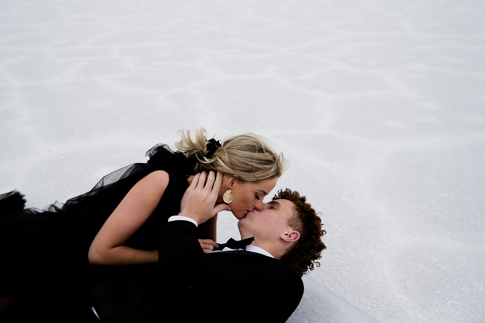 Couple shares a moment of intimacy in Utah Salt Flats photography session