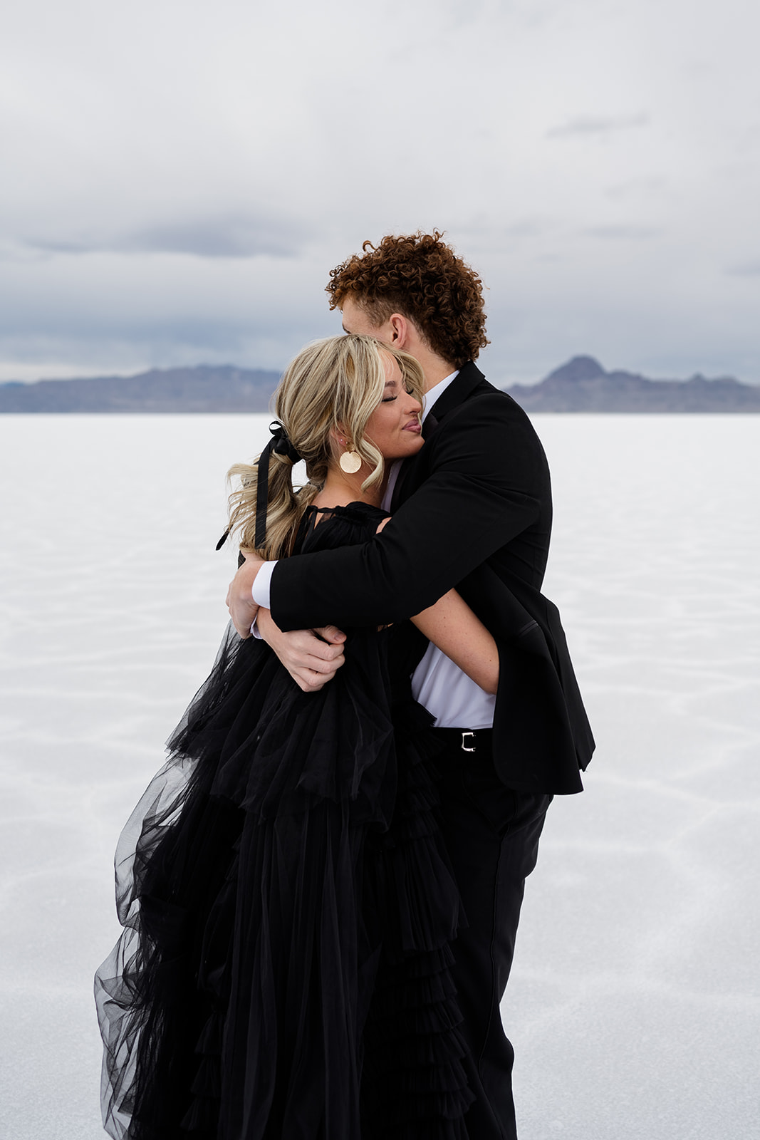 Laughter and love captured by Utah photographer at Salt Flats engagement