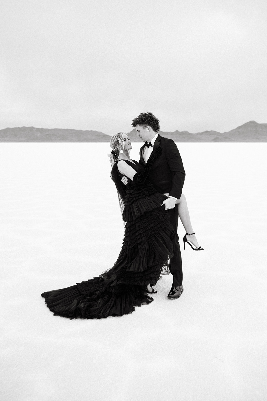 Photographer captures intimate dance with a dip during Utah Salt Flats wedding shoot