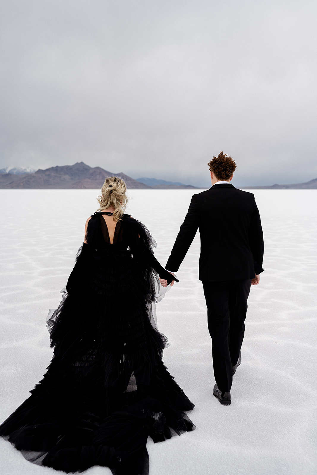 Utah Salt Flats elopement session featuring a stunning black dress train