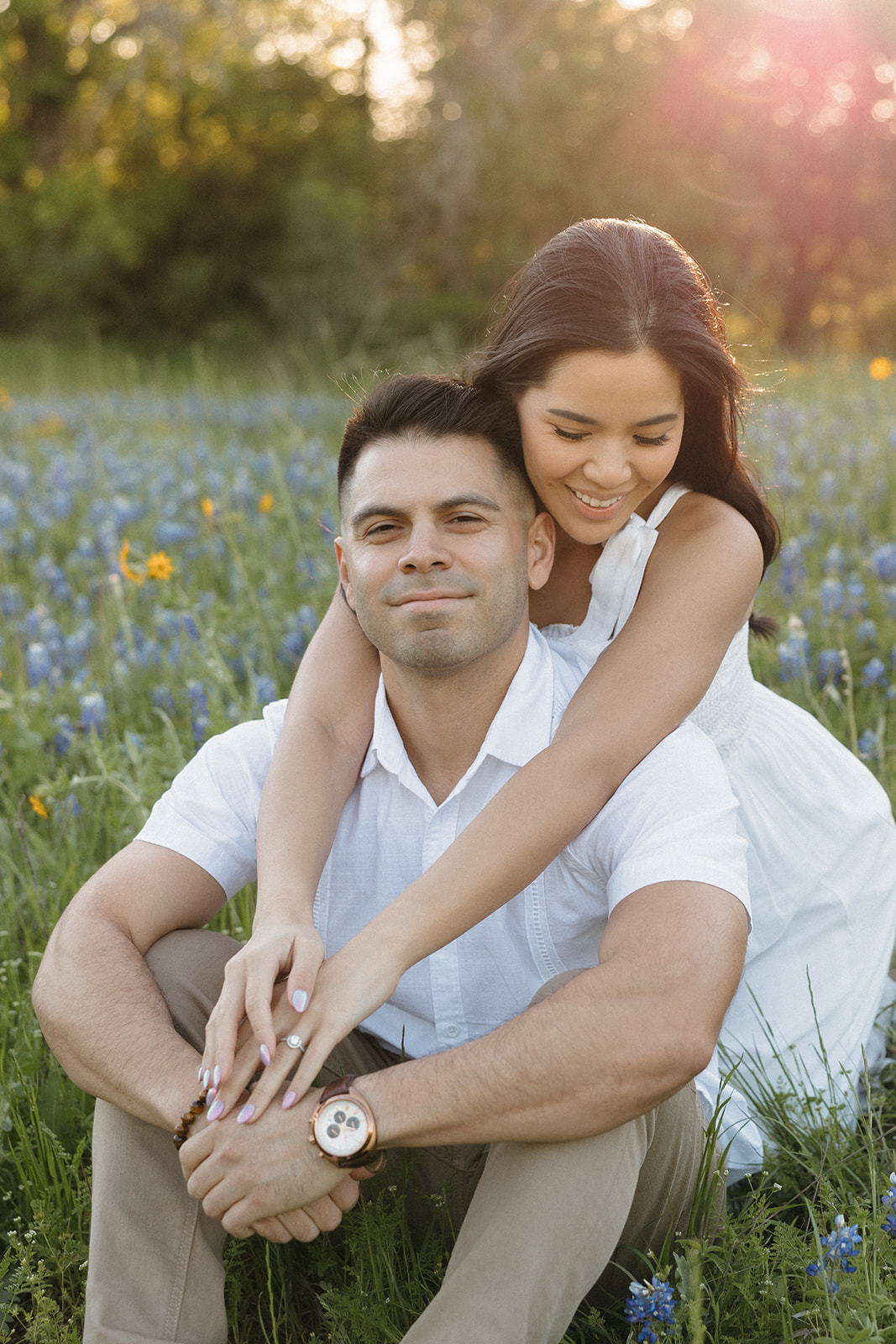Couple sitting in field of Bluebonnets at McKinney Falls state park