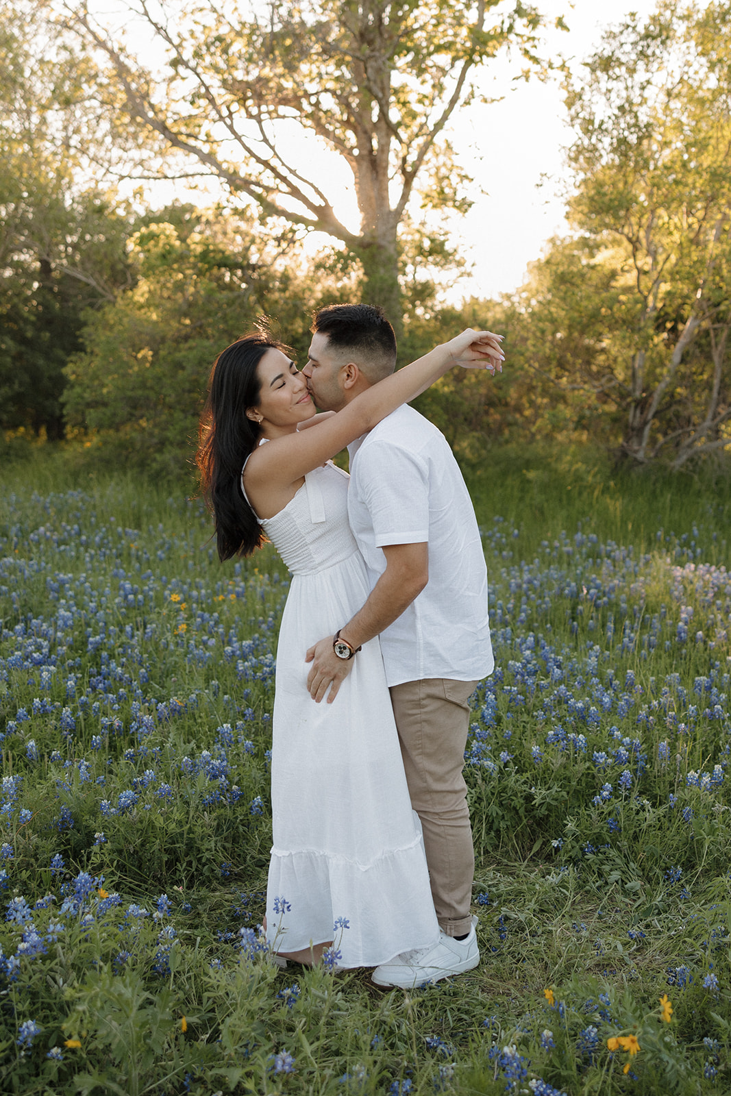 Couple dancing in a field of Bluebonnets at McKinney Falls state park