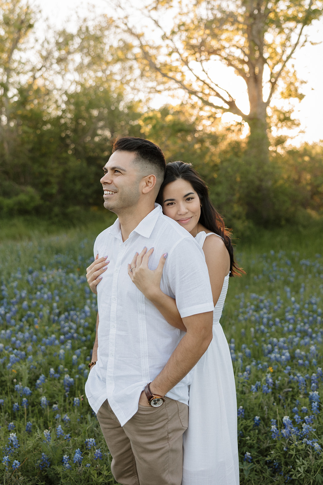 Couple hugging in a field of Bluebonnets at McKinney Falls state park