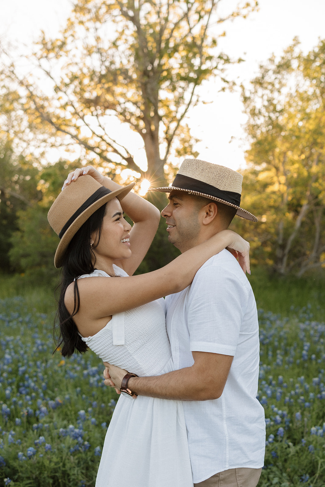 Couple kissing in a field of Bluebonnets at McKinney Falls state park
